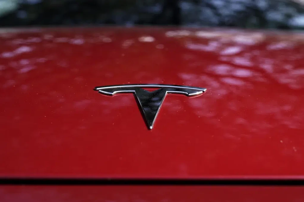 Tesla says it will cut costs of next generation cars in half