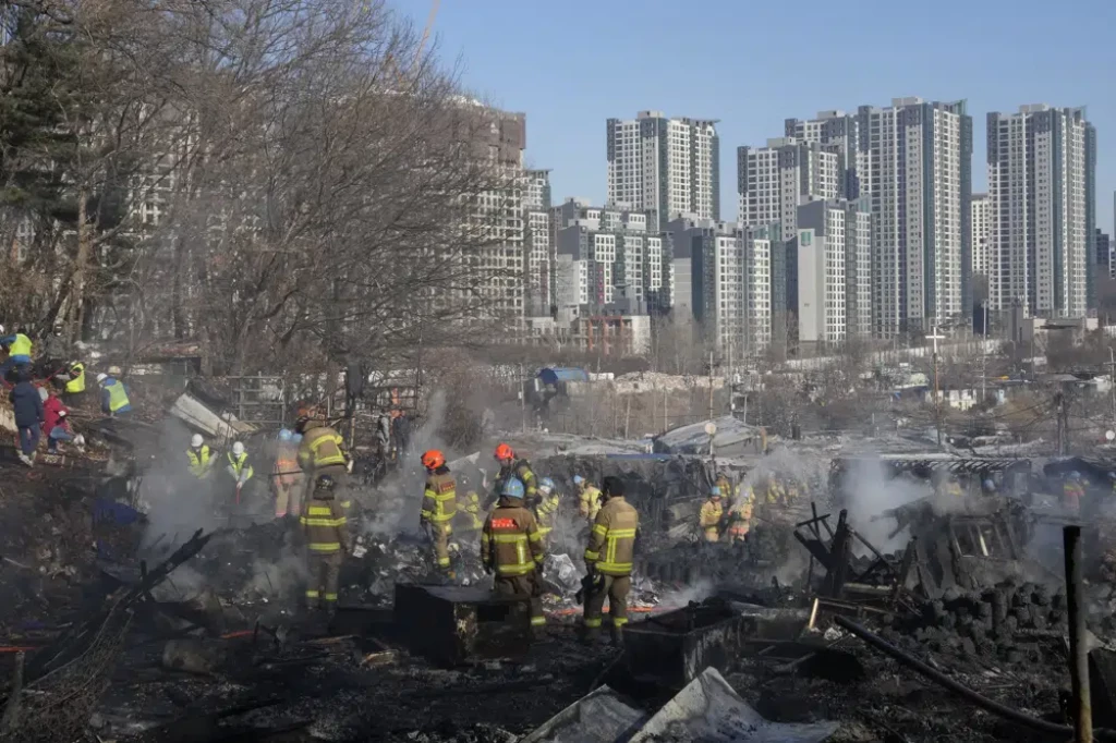 Fire burns makeshift homes in shadow of Seoul’s skyscrapers