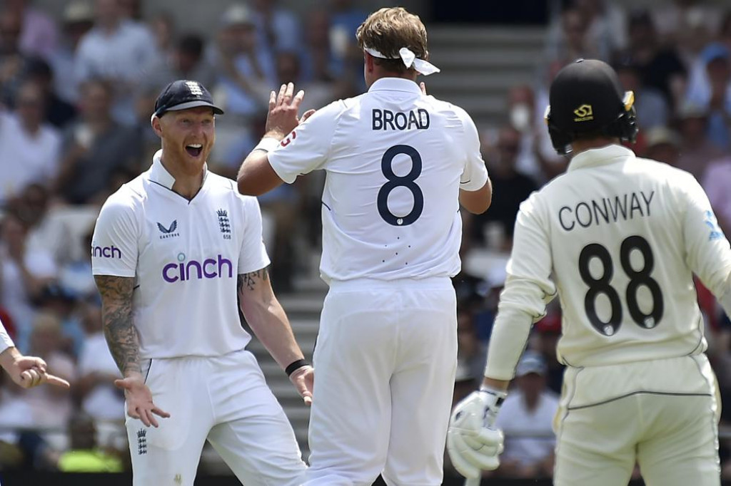 England bowler Stuart Broad celebrates with Ben Stokes and catcher