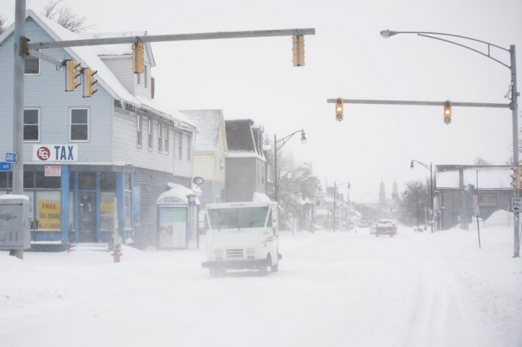 Massive snowfall buries cars, keeps falling in western NY