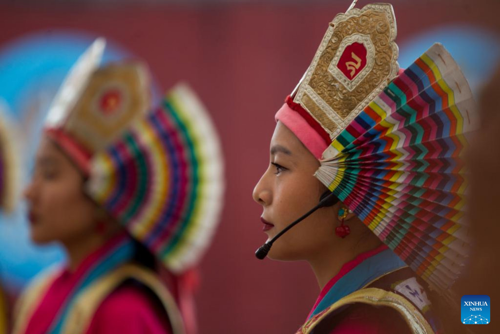 A girl in traditional attire performs during the celebration of Gyalpo Lhosar Festival at Boudha in Kathmandu, Nepal, Feb. 23, 2023. (Photo by Sulav Shrestha/Xinhua)
